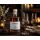 Lorenz & Söhne Tresterbrand Merlot mit zwei Edelbrandgläsern, dunkler Schokolade und Kerzenlicht in stimmungsvoller Atmosphäre