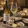 Groot Constantia Sauvignon Blanc mit halb gefülltem Weißweinglas sowie einem Teller Austern und Zitrone